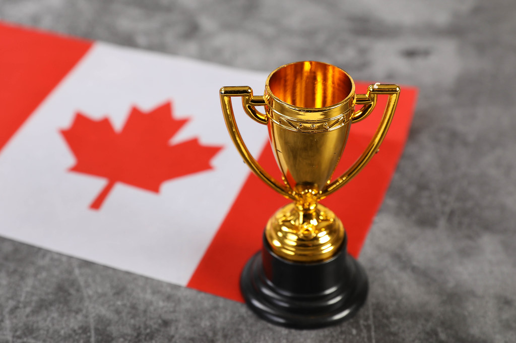 Golden trophy with flag of Canada