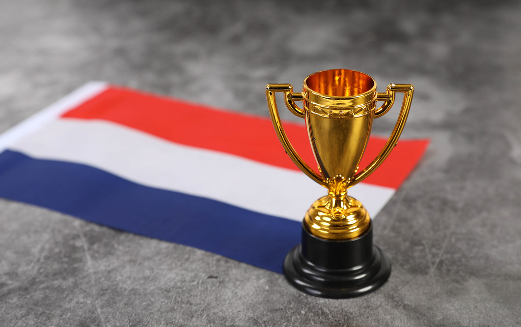 Golden trophy with flag of Netherlands