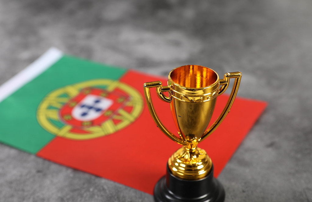 Golden trophy with flag of Portugal