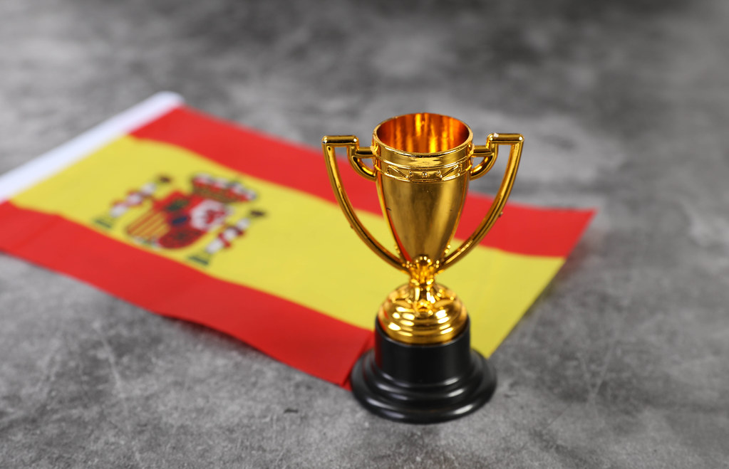 Golden trophy with flag of Spain