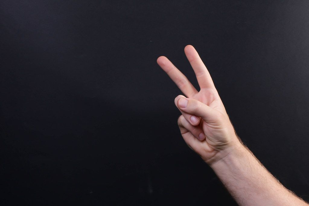 Hand showing peace sign or victory sign