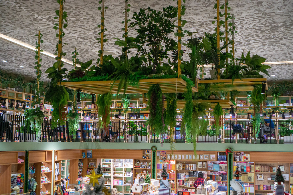 Hanging Wooden Board decorated with many Plants in a Multi Level Book Store in Ho Chi Minh City, Vietnam