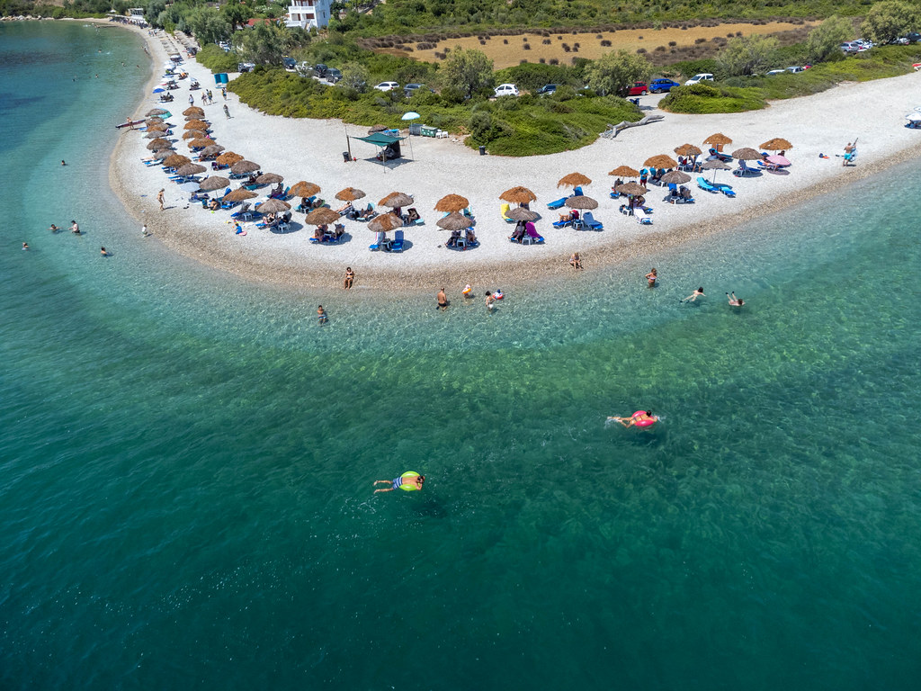 Holidaymakers enjoying the transparent waters of Paralia Agios Dimitrios on Alonnisos in summer 2021