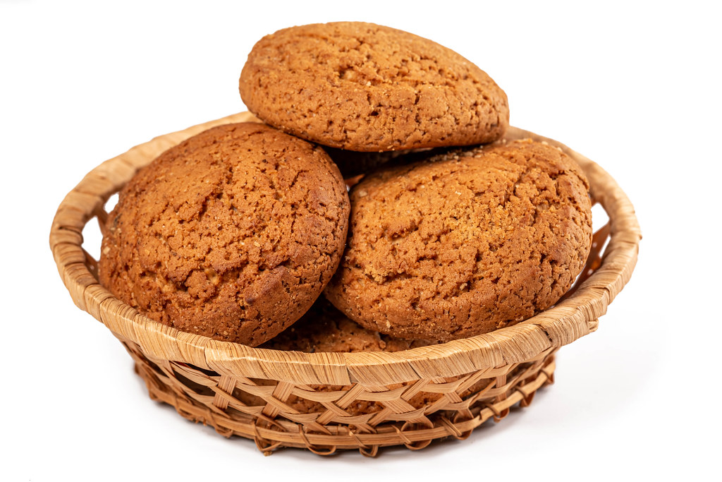 Homemade baking - oatmeal cookies in wicker basket
