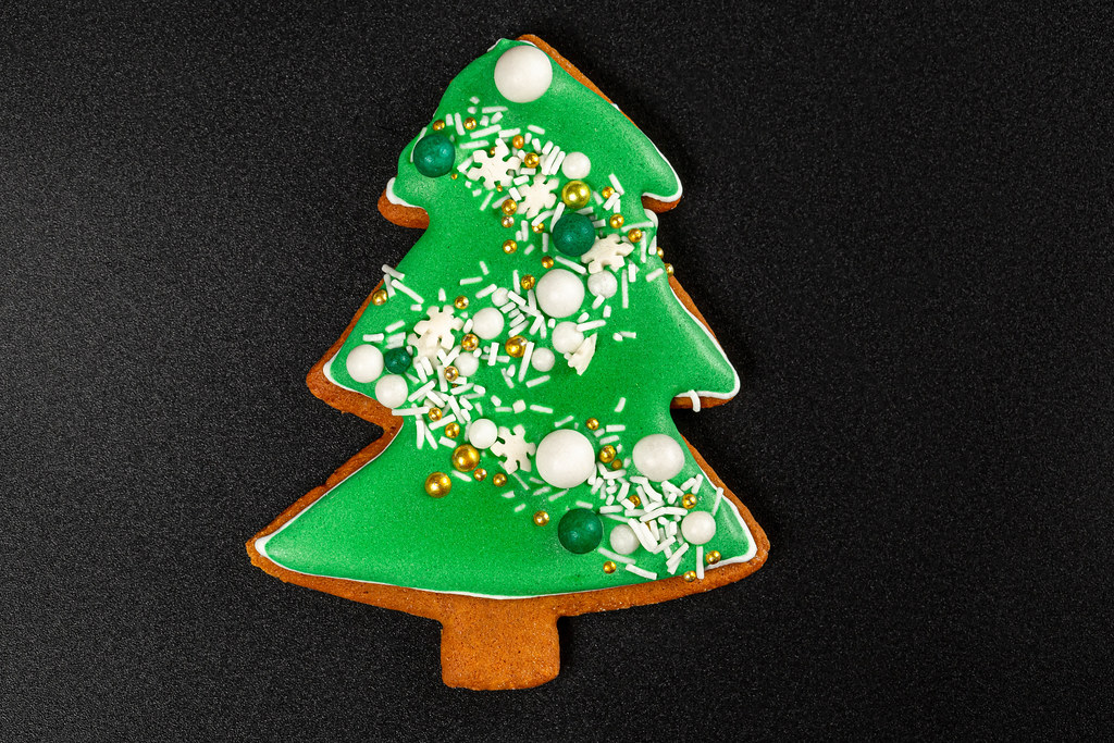 Homemade gingerbread tree on a black background