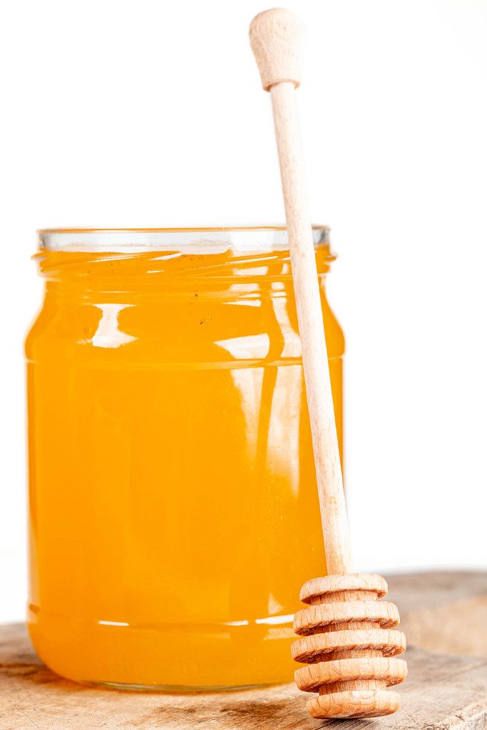 Honey dipper and honey in jar