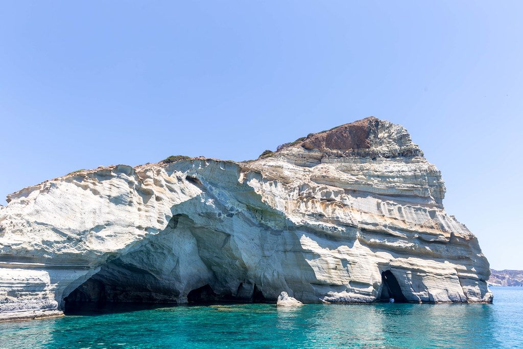 Impressive rock formations, natural arches and turquoise waters in Kleftiko, Milos (Greece)