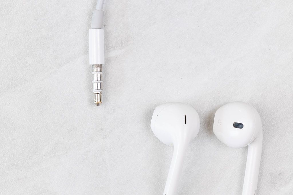 Iphone Headphones with copy space above white background