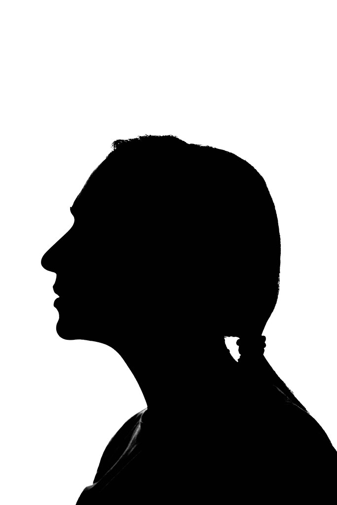 Isolated silhouette of a young woman against the white background