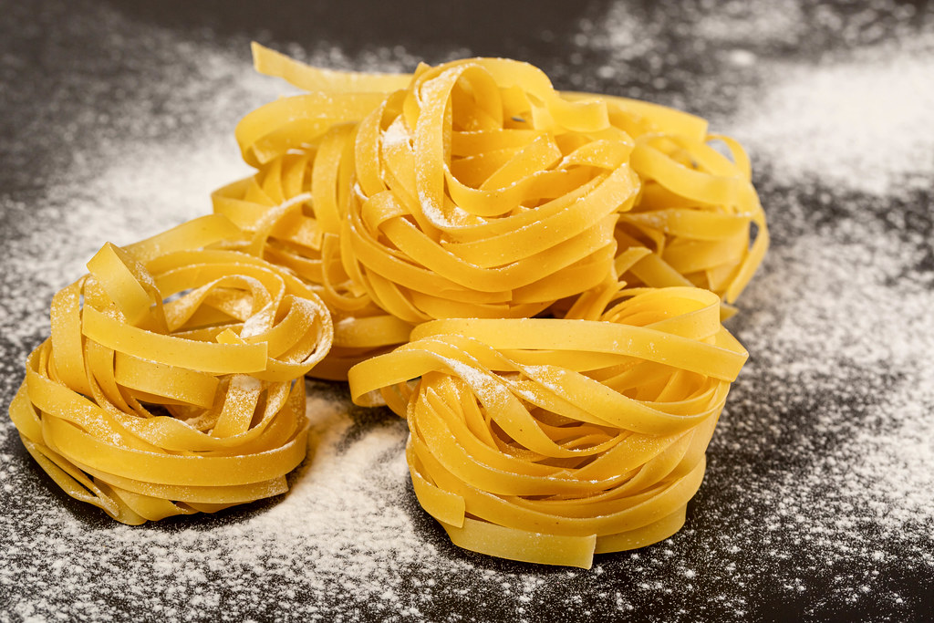 Italian rolled fresh fettuccine pasta with flour