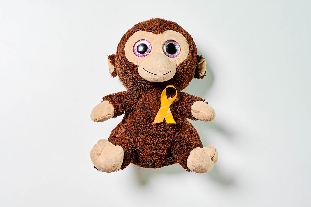 Kid's plush monkey toy with yellow ribbon - Childhood Cancer Day