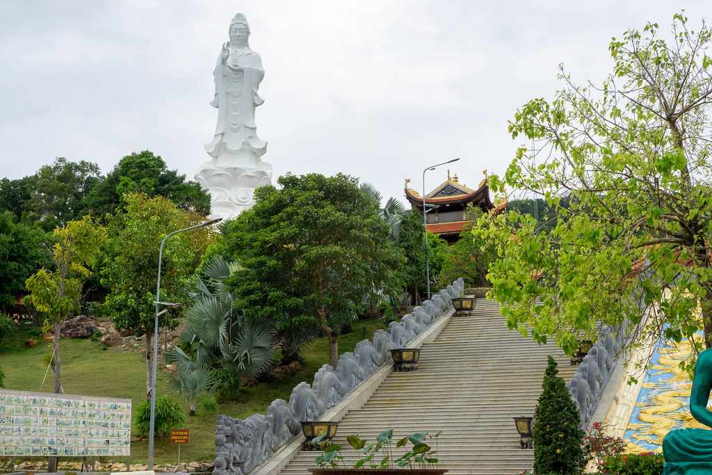 Large Lady Buddha Statue at the Buddhist Temple Truc Lam Ho Quoc with many Trees and Plants on Phu Quoc Island in Vietnam