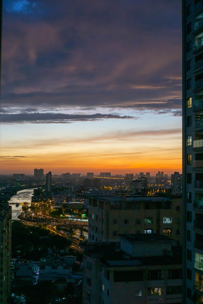 Last Minutes of Sunset at Golden Hour with View of Traffic in Ho Chi Minh City and District 5 in Saigon, Vietnam