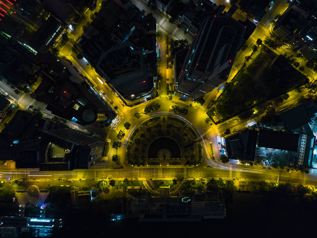 Long Exposure Drone Photo of the Roundabout around Tran Hung Dao Statue with Hilton Hotel and Renaissance Riverside Hotel in Ho Chi Minh City, Vietnam