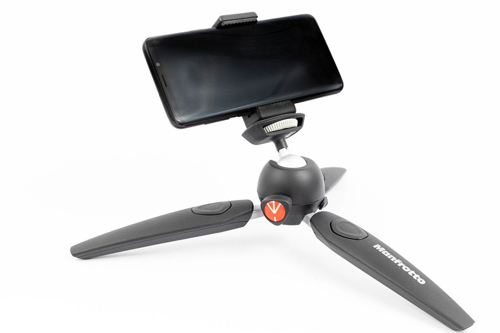 Manfrotto desktop camera tripod with Mobile phone mounted on it