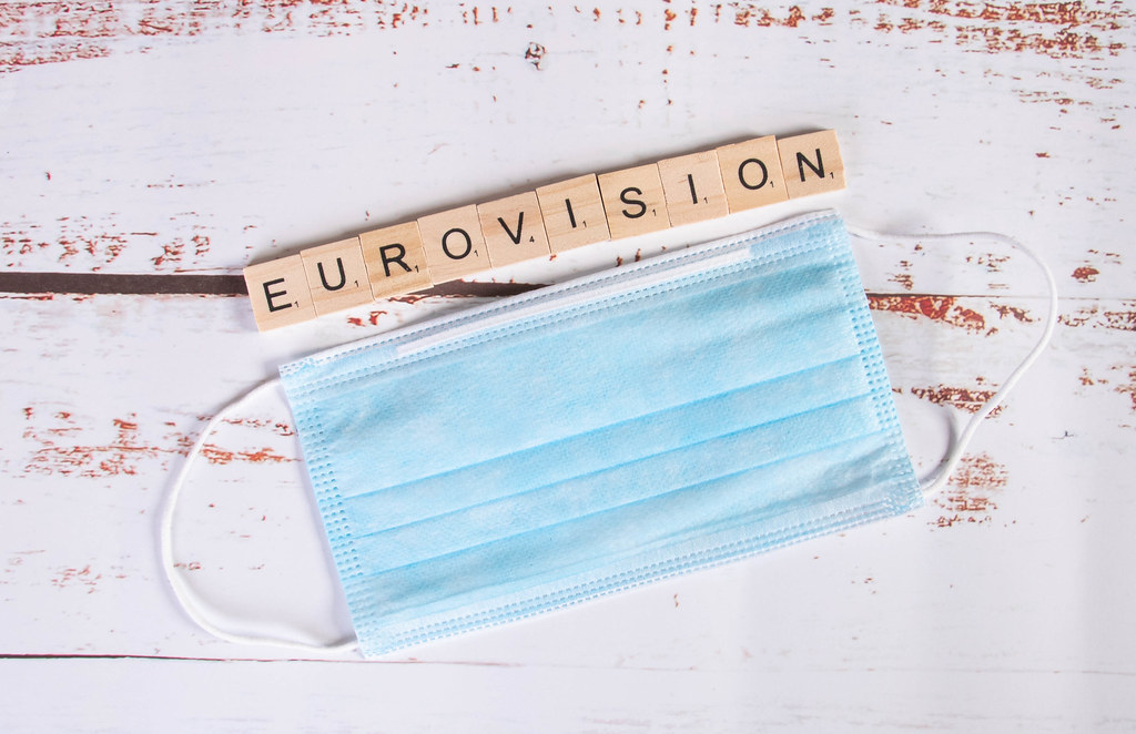 Medical face mask and Eurovision text on wooden blocks