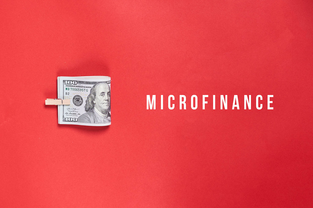 Microfinance concept - Money on red background