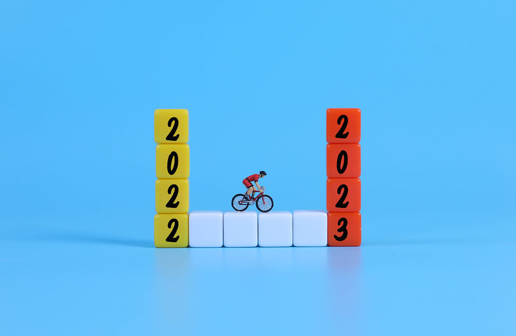 Miniature cyclist on blocks with 2022 and 2023 text