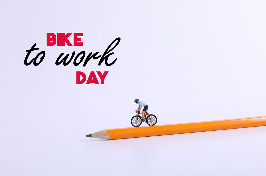 Miniature Figure Ride Bicycle on pen and Bike to Work Day text