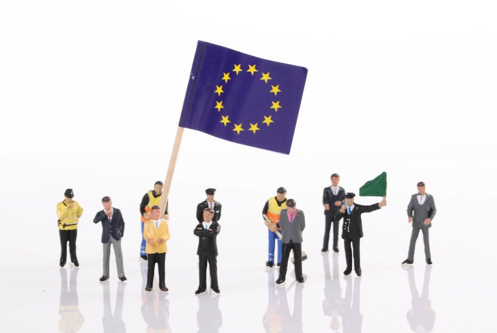 Miniature people with flag of European Union