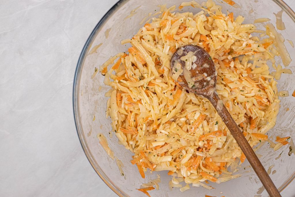 Mixture of grated Potatoes and Carrots in the bowl