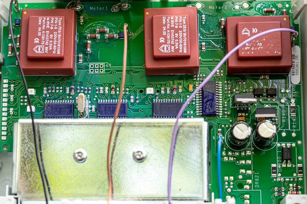 Motherboard with electrical wires. Electrical appliance background inside