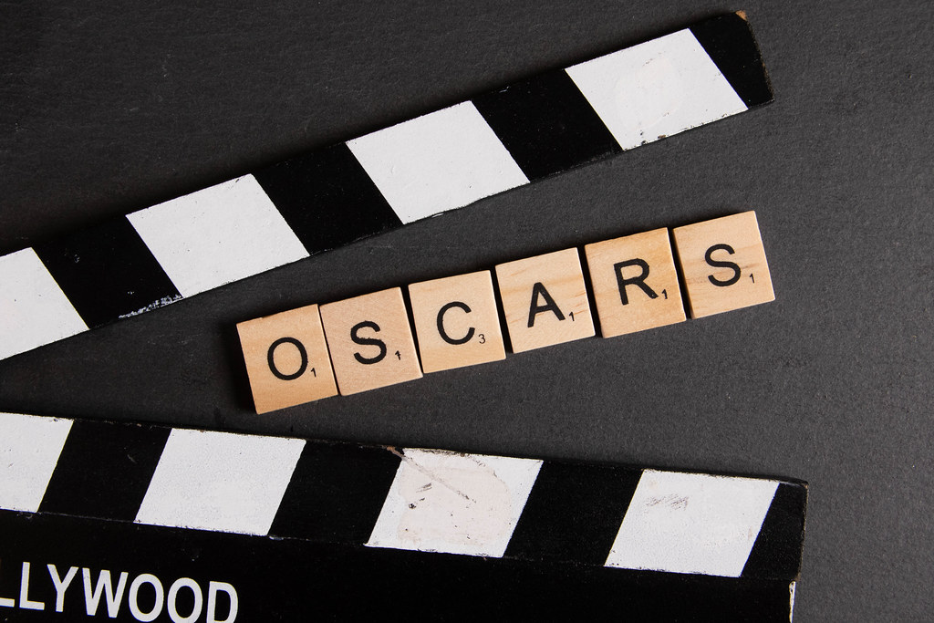Movie clapper with Oscars text on black background