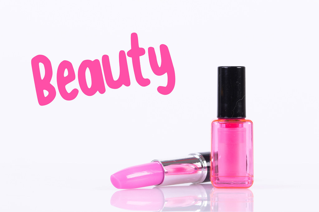 Nail polish and make up with Beauty text on white background