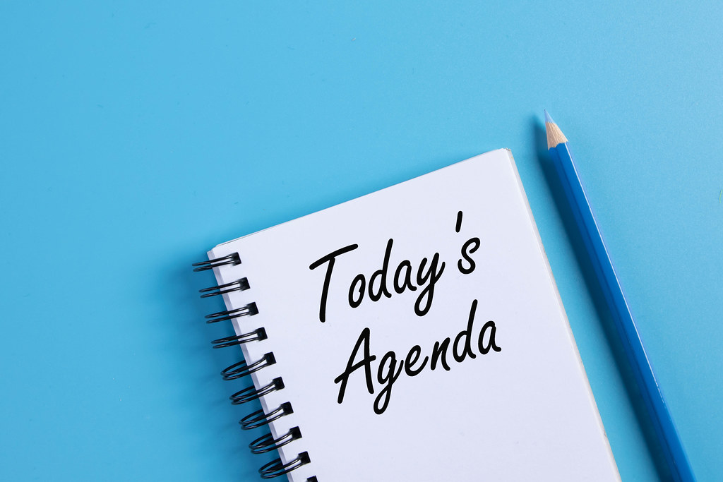 Notebook with 2021 Today's Agenda text on blue background