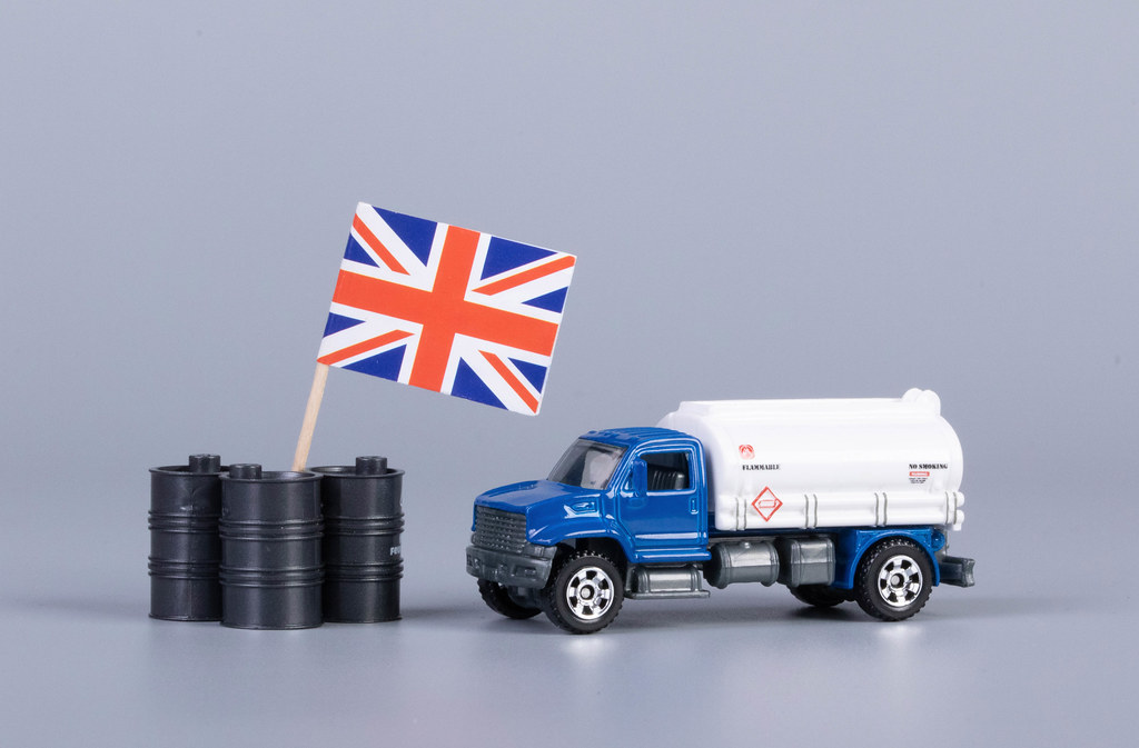 Oil truck and oil barrels with flag of United Kingdom