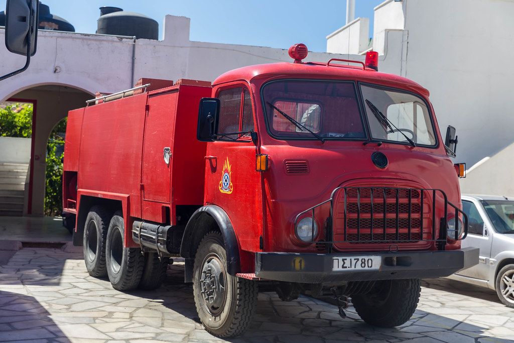 Old style red fire brigade vehicle in the small village of Chalkio in the interior of the Greek island Naxos