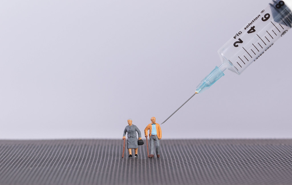Older couple with syringe