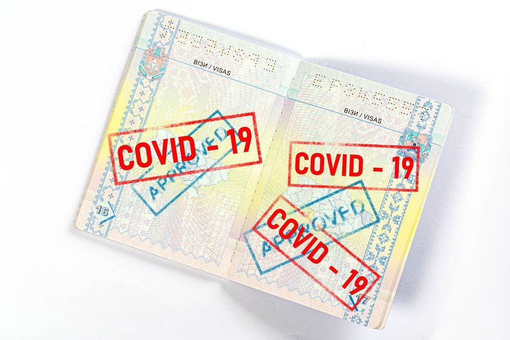 Open passport with many stamps. Travel concept during quarantine
