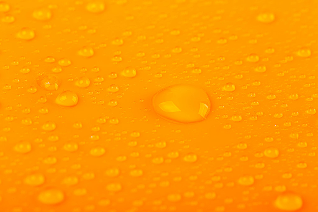 Orange background with water drops