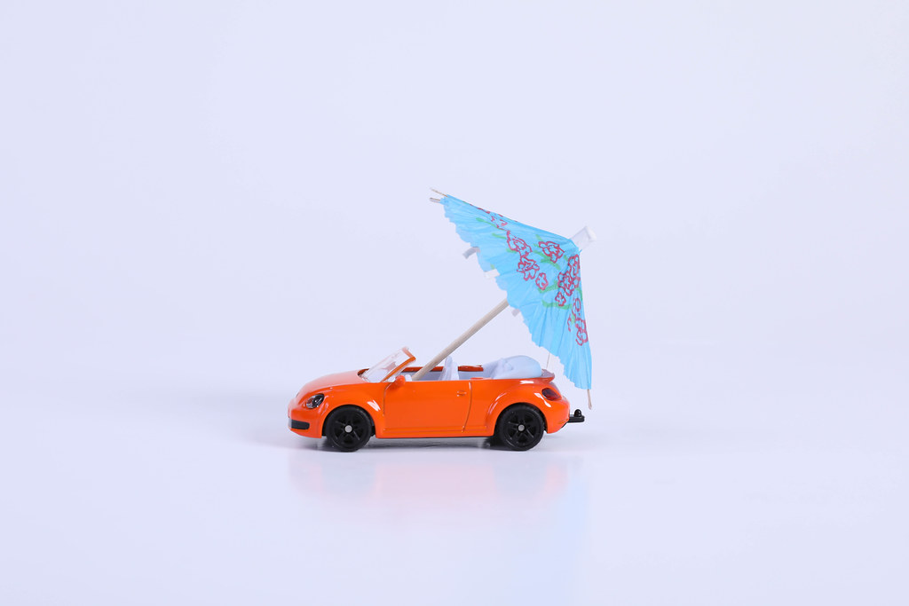 Orange car with blue umbrella