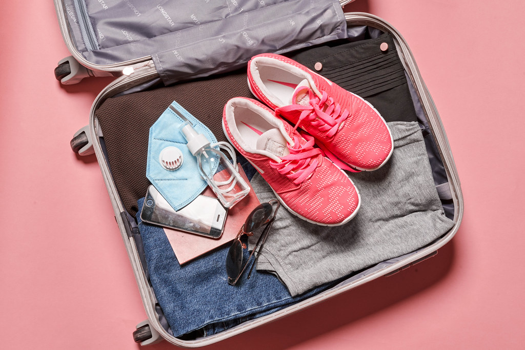 Packing clothes into travel bag