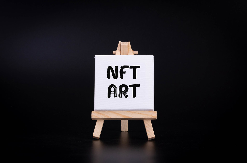 Painting art board with NFT Art text on black background