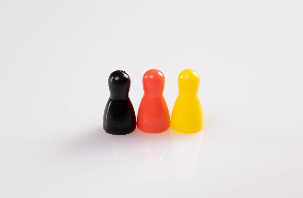 Pawn figurines on white background