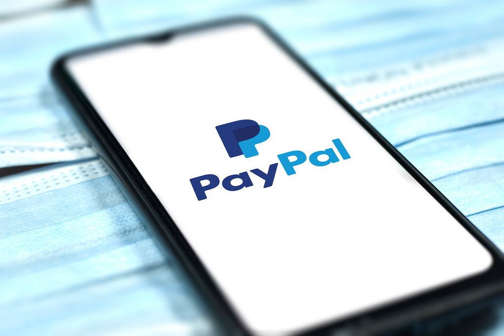 Paypal logo on smartphone. Coronavirus crisis changing global business rules