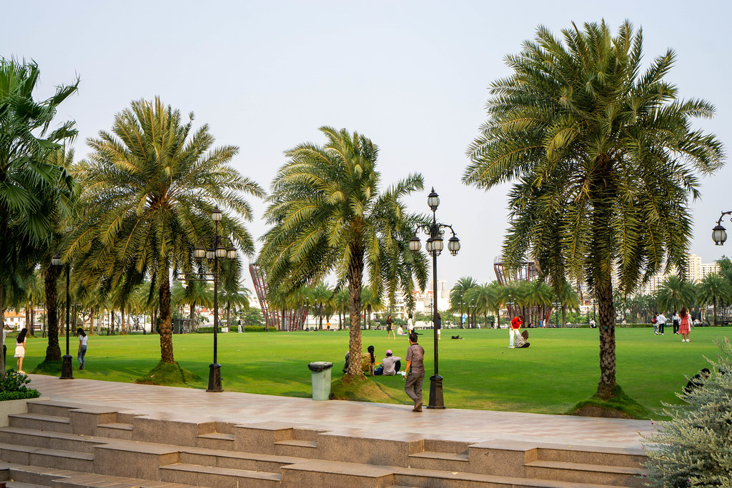 People walking, doing Sports and having Picnic at Vinhomes Central Park in Ho Chi Minh City, Vietnam