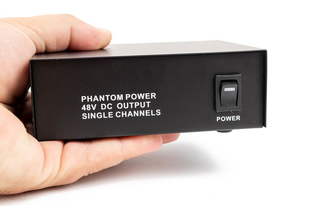 Phantom Power Microphone adapter box in the hand