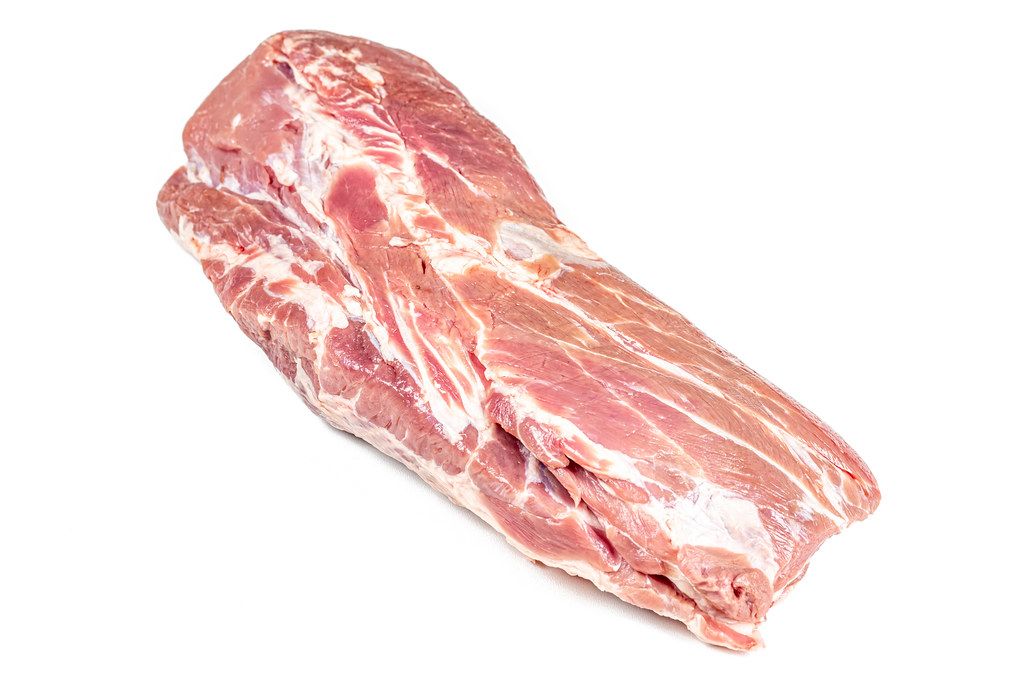 Piece of fresh raw meat on white background