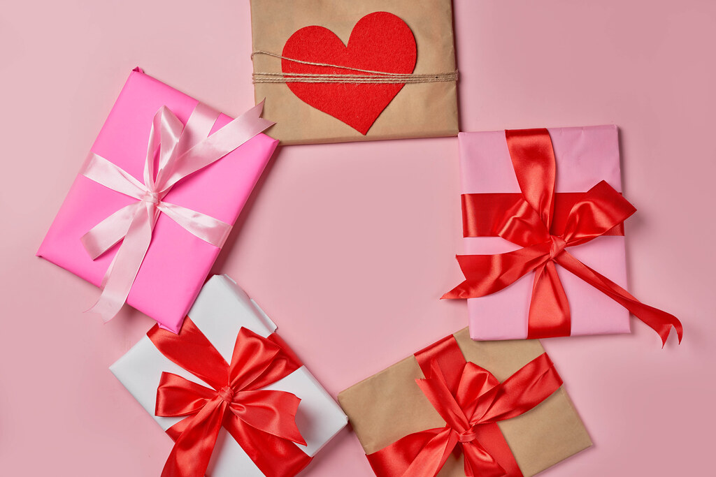 Pile of giftboxes on pink background