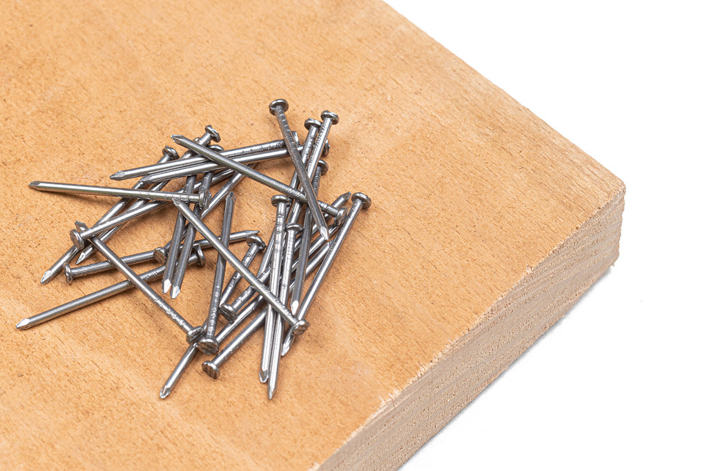 Pile of Nails on the wooden board