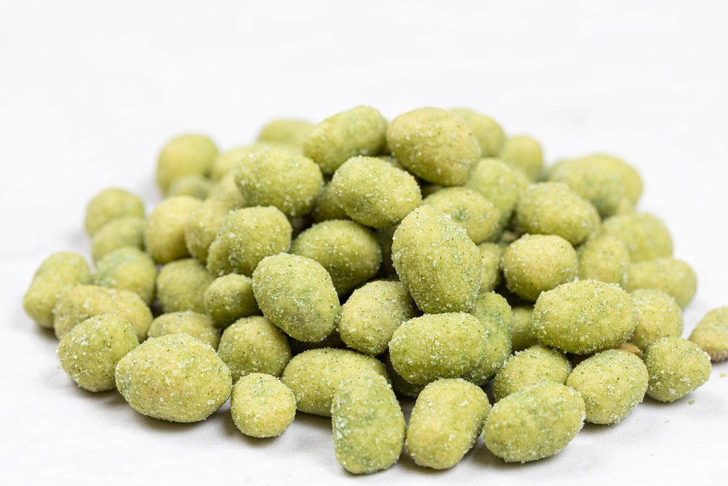 Pile of Spiced Wasabi Nuts above white background