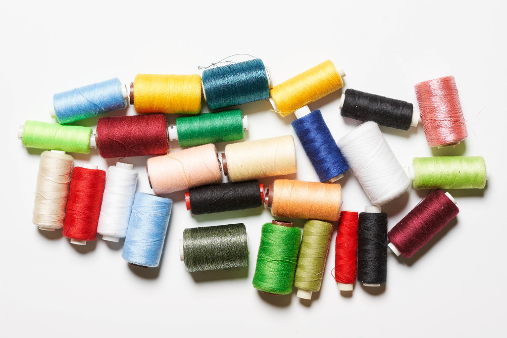 Pile of spools with colorful threads