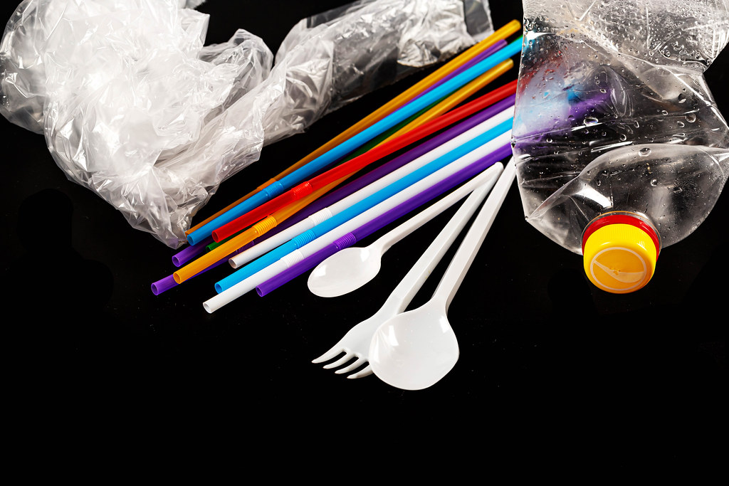 Plastic dishes and bags on a black background