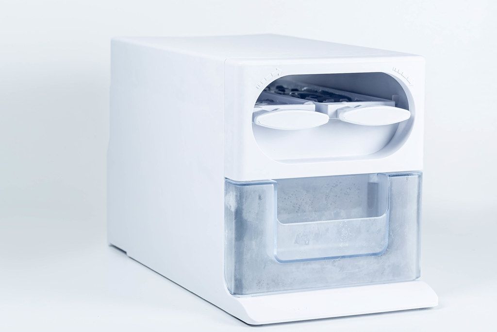 Plastic ice cube tray on white background