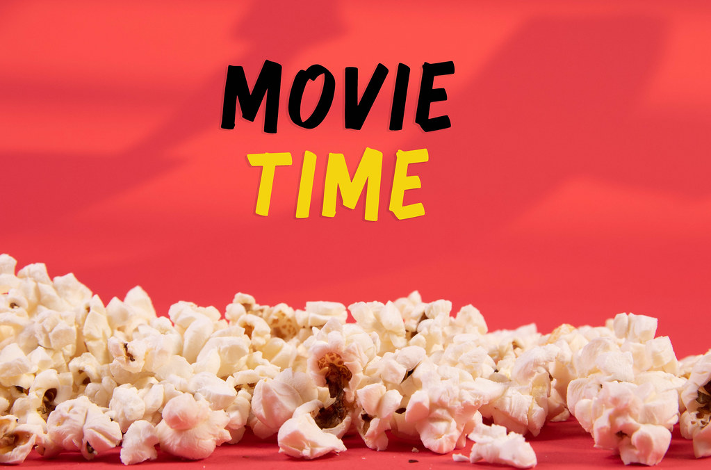 Popcorn and Movie Time text on red background