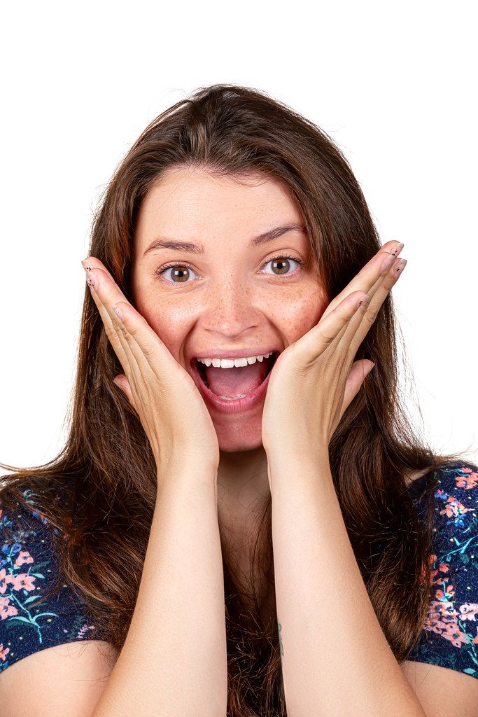 Portrait of a laughing girl. The concept of joy, pleasant surprise